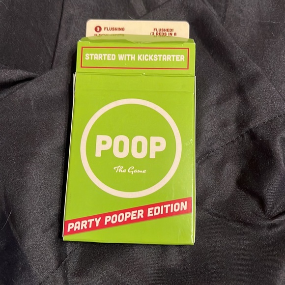 Poop card game like new has some of the adhesive on box from price. - Picture 2 of 3